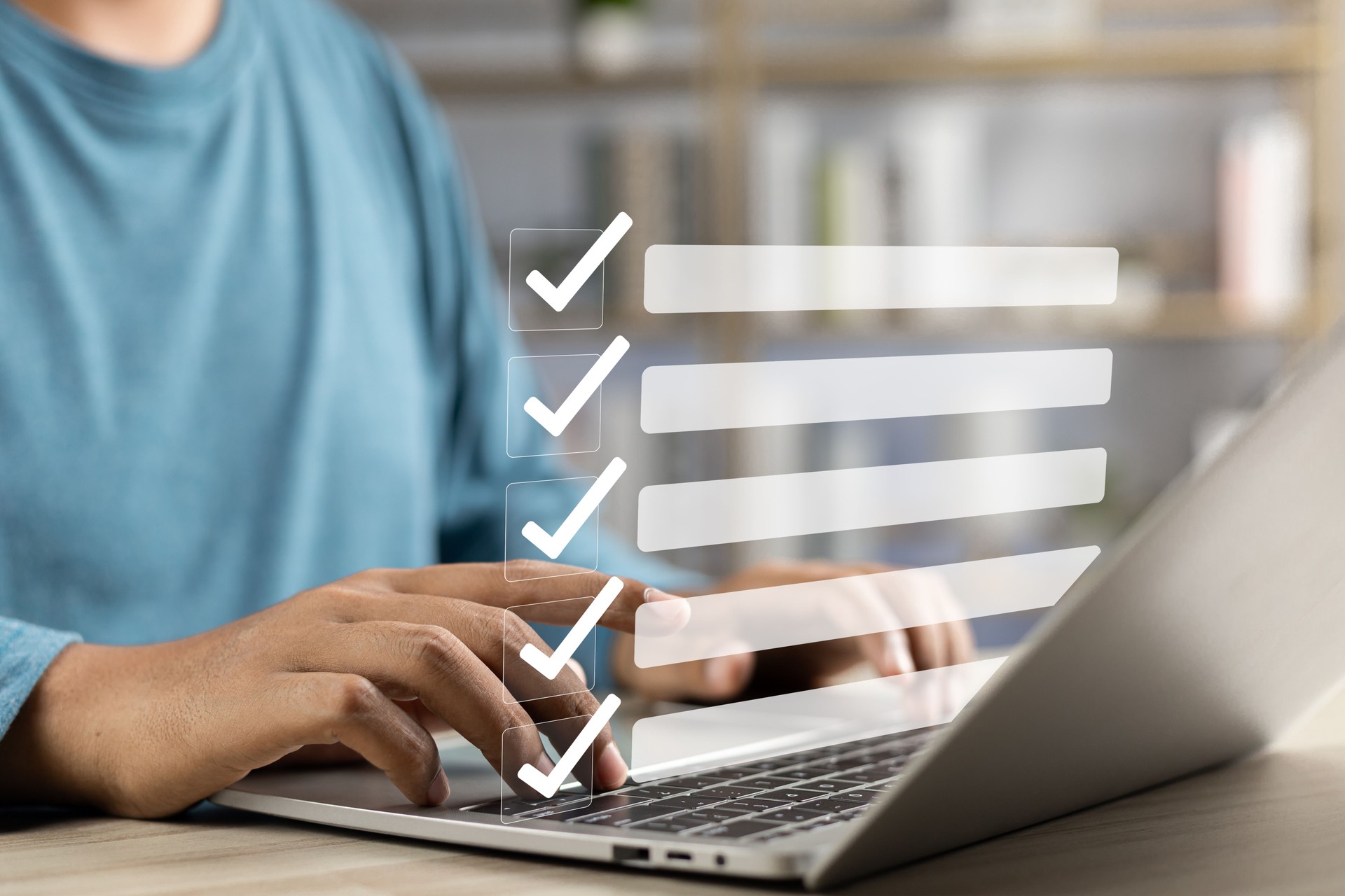 Person using a laptop to complete an online delivery scheduling form, with checklist graphics displayed on screen.